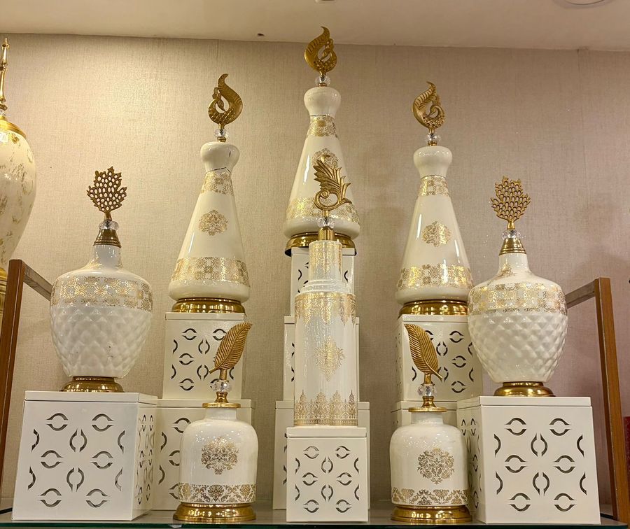White and Gold Showpieces with Flame Tops