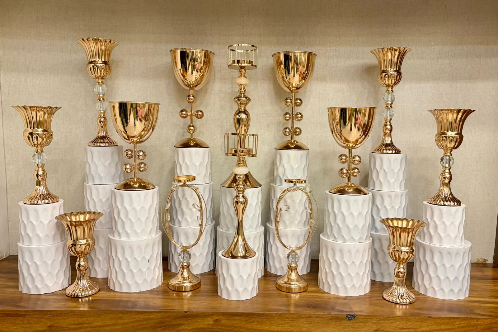 Gold Goblet Vases on Quilted White Stands