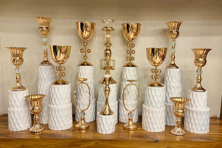 Gold Goblet Vases on Quilted White Stands